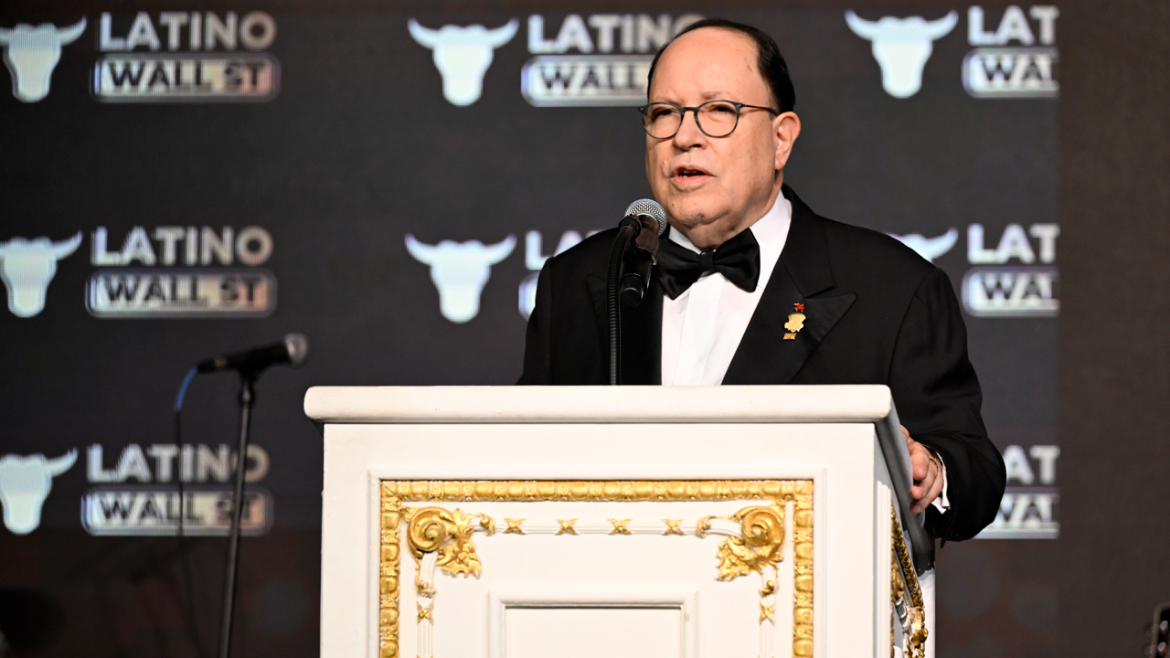 A speaker addressing a public gathering at a Latino Wall Street event